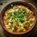 Cottage cheese buffalo chicken dip recipe card with ingredients and finished dish